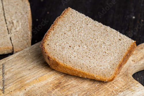 a loaf of dark rye sour bread in the kitchen