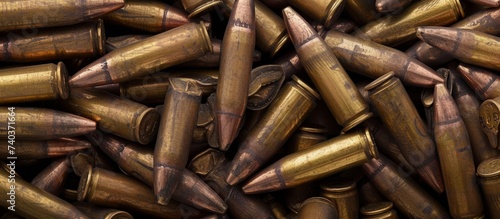 A pile of bullets on the ground showcasing the aftermath of a fierce battle