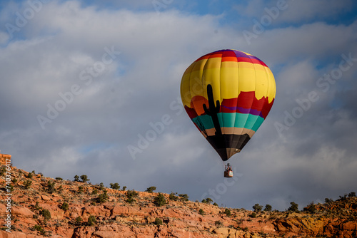 hot air balloons floating over southern Utah desert © Tedi S Photography