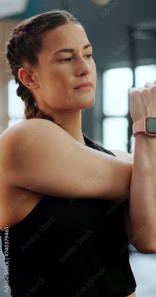 Fitness, gym and woman stretching arms for muscle training or workout for health, wellness or body. Sports, smartwatch and young female athlete with warm up exercise for bones in studio or center. Fitness, gym and woman stretching arms for muscle training or workout for health, wellness or body. Sports, smartwatch and young female athlete with warm up exercise for bones in studio or center.
