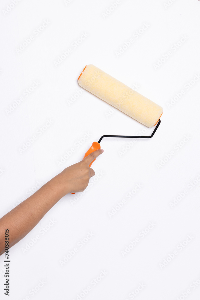Decorator's hand painting wall with roller Decorator's hand painting wall with roller