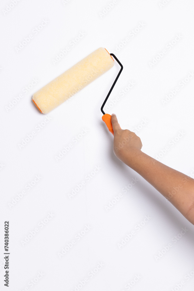 Decorator's hand painting wall with roller Decorator's hand painting wall with roller
