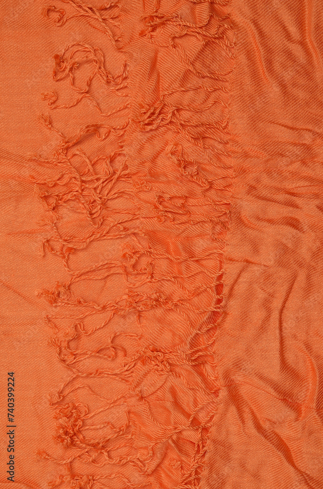 Fototapeta premium Orange crumpled textile background.