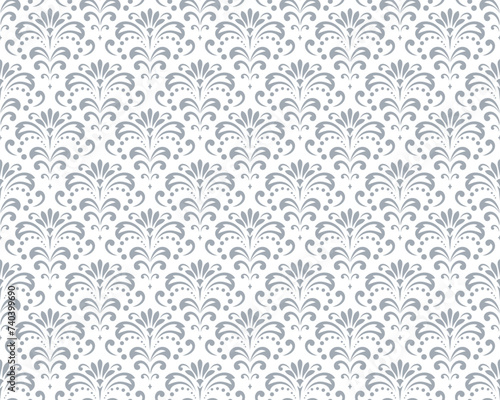 Wallpaper in the style of Baroque. Seamless vector background. White and gray floral ornament. Graphic pattern for fabric, wallpaper, packaging. Ornate Damask flower ornament.