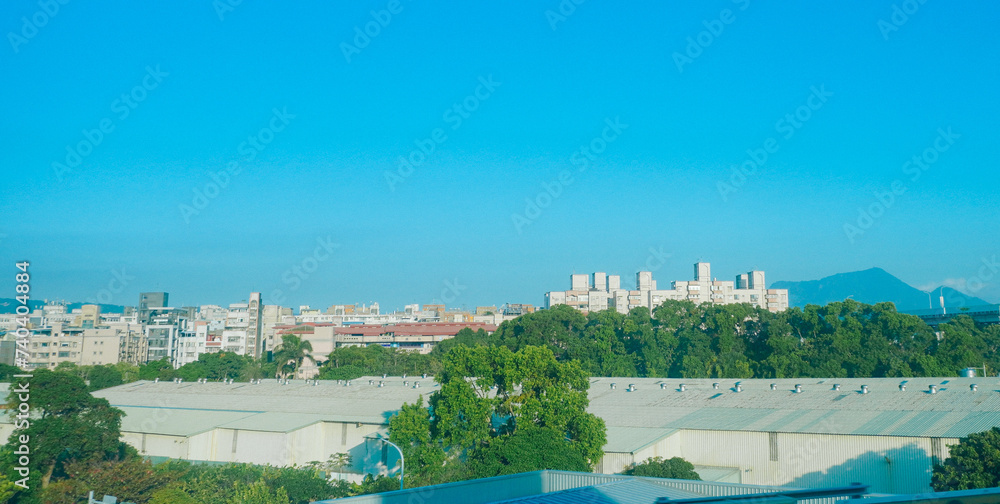 Obraz premium Taipei, Taiwan, Republic of China, 01 19 2024: New Taipei city (in Republic of China, Taiwan) landscape and mountain seen from high speed train