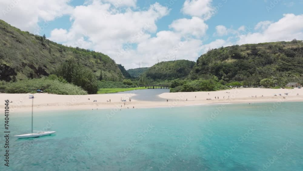 Cinematic aerial Waimea Bay Beach on sunny summer day. People enjoy vacation on beautiful sandy beach. Scenic nature landscape of Hawaii island. Waimea Valley panorama on Oahu North shore USA travel Cinematic aerial Waimea Bay Beach on sunny summer day. People enjoy vacation on beautiful sandy beach. Scenic nature landscape of Hawaii island. Waimea Valley panorama on Oahu North shore USA travel