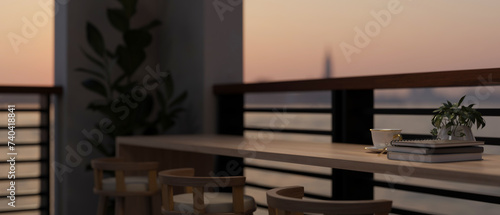 A table with stools on a balcony at dawn with a beautiful view. close-up image © bongkarn