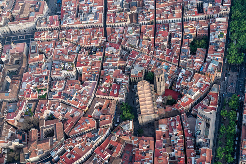 Aerial top down view of Barcelona old town buildings, Spain. Late afternoon light