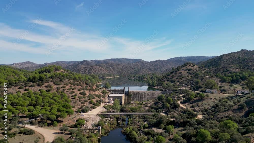 Encinarejo reservoir damhead above River Jandula Sierra de Andujar AERIAL REVEAL Encinarejo reservoir damhead above River Jandula Sierra de Andujar AERIAL REVEAL
