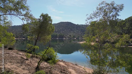 Sierra de Andujar nature reserve beauty spot stunning views over forest reflected lake AERIAL PUSH
 photo