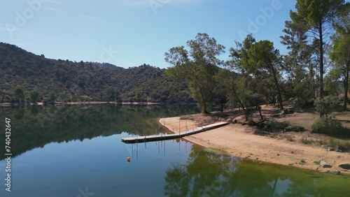 Idyllic recreation beach on Encinarejo reservoir, Sierra de Andujar nature reserve AERIAL photo