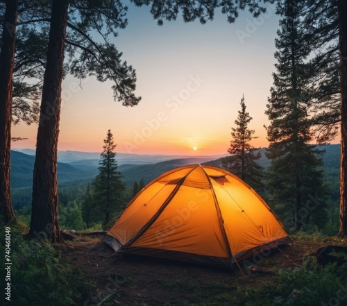 Orange tent in the forest at sunset
