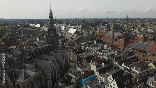 Parallax drone shot of old church in between the old Amsterdam city in The Netherlands. photo