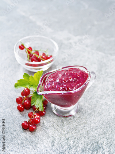 Sauce of redcurrant on granite table