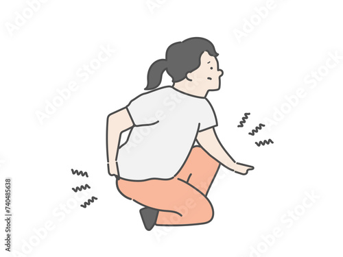 腰を痛めた女性介護士