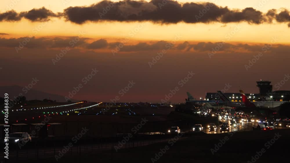 Beautiful Shot of Traffic Around Juan Santa Maria Internation Airport in Costa Rica at Dusk Beautiful Shot of Traffic Around Juan Santa Maria Internation Airport in Costa Rica at Dusk