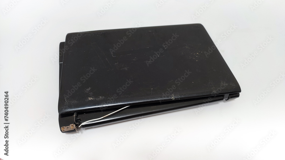 Broken black laptop hinge, isolated on white Broken black laptop hinge, isolated on white