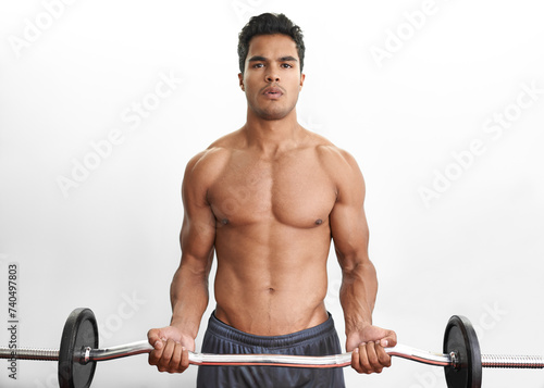 Man lifting barbell, portrait and fitness in gym, strength training and endurance with bodybuilding. Exercise, mockup space and person with equipment, power and workout in a wellness center or muscle