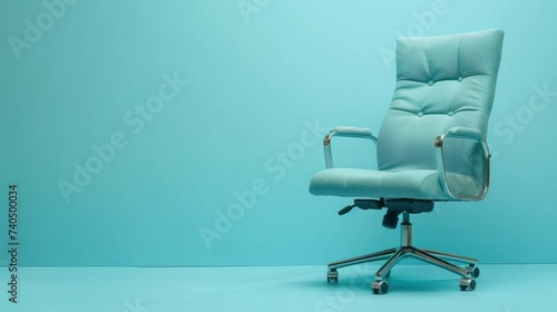 Cozy and comfortable blue leather office chair on blue background, space for text or ads