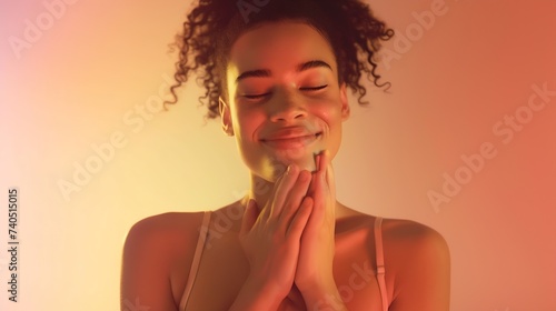 Beautiful positive friendlylooking young mixed race woman with lovely sincere smile feeling thankful and grateful showing her heart filled with love and gratitude holding hands on her  : Generative AI photo