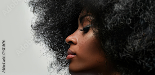 Young African American woman with afro hair isolated from the background