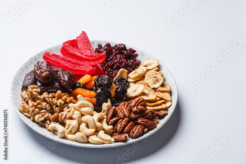 Dried fruits and nuts on a plate to celebrate the Jewish holiday Tu Bi Shvat. photo