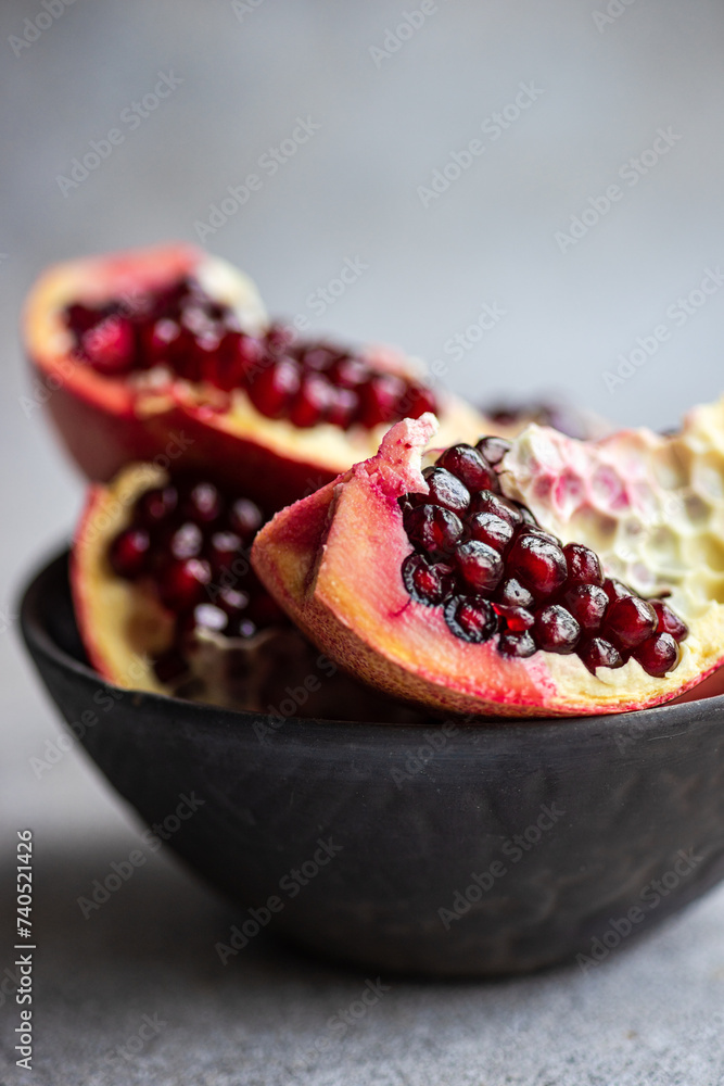 Raw organic pomegranate in the bowl Raw organic pomegranate in the bowl