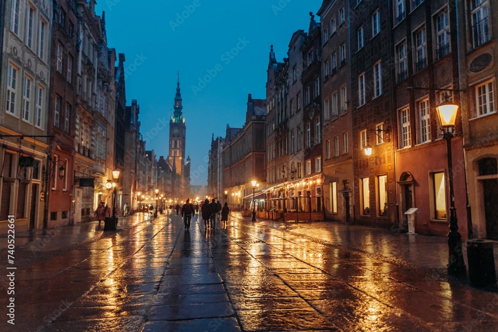 Evening street in the old town in Gdansk Poland, wet snow