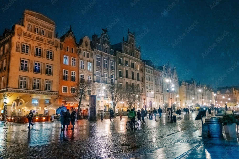 Fototapeta premium evening street in the old town in Gdansk Poland, snowstorm
