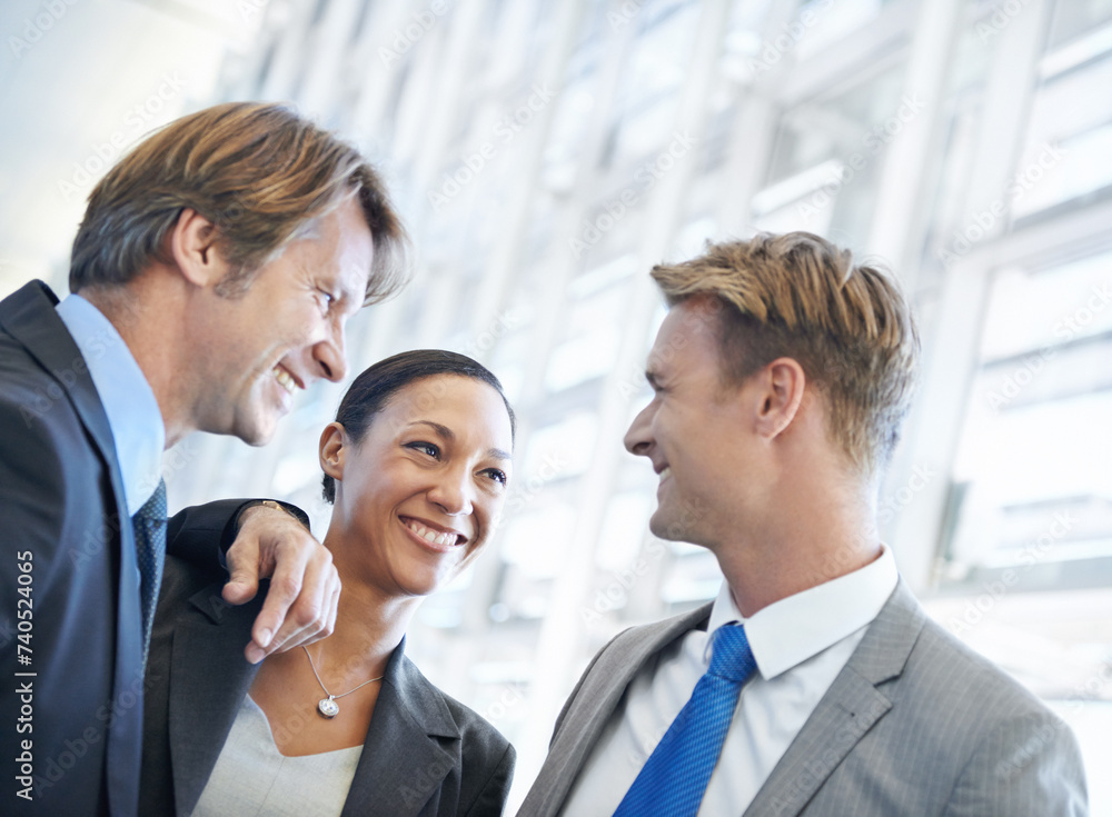 Collaboration, smile and talking with business people in office as friends for meeting or discussion. Corporate, partnership or teamwork with happy professional employee group chatting in workplace Collaboration, smile and talking with business people in office as friends for meeting or discussion. Corporate, partnership or teamwork with happy professional employee group chatting in workplace