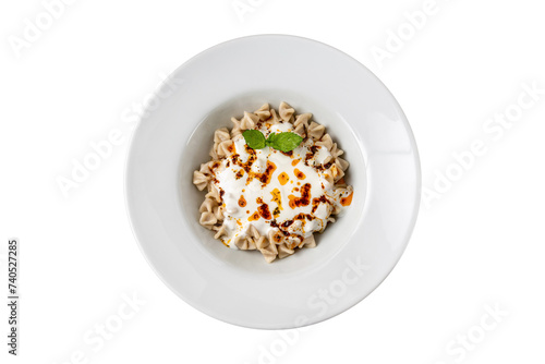 Kayseri ravioli or Kayseri Mantisi on a white plate on white background