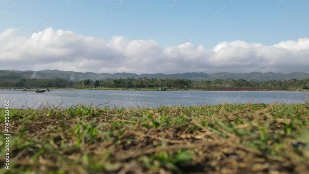 time lapse view of lake landscape with low angle view time lapse view of lake landscape with low angle view