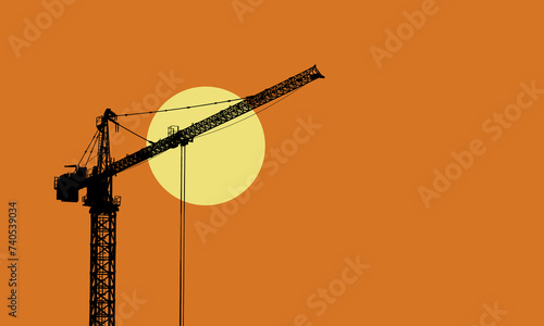 Construction site silhouette with tower crane and the rising sun
