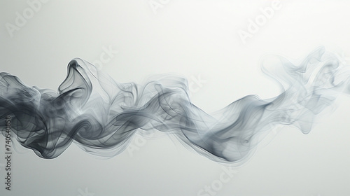 Wisps of smoke in a graceful ballet over a clean white surface, portraying a dance of elegance and lightness. photo