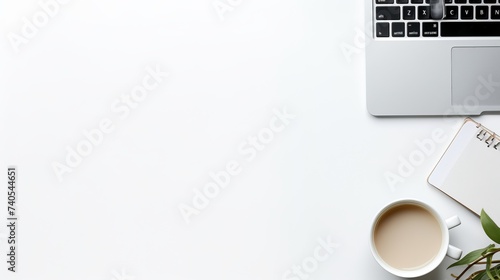 Desk with laptop, eye glasses, earphone, pen, document clips and a cup of coffee. Top view with copy space