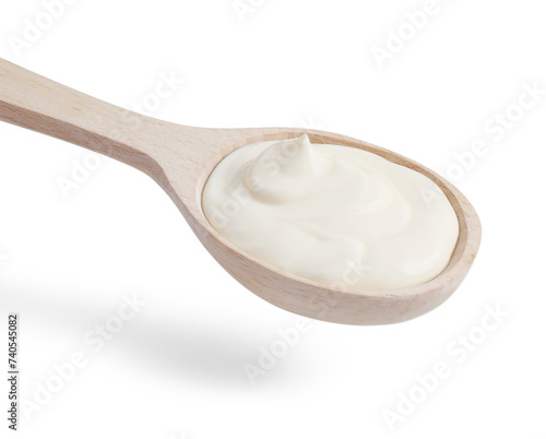 One wooden spoon with mayonnaise isolated on white