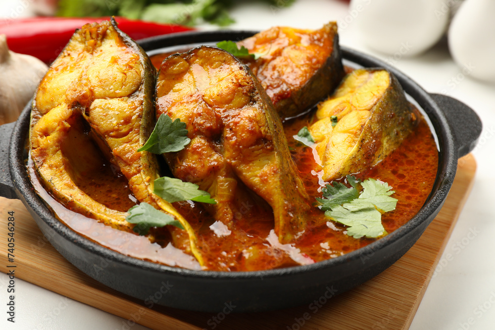 Tasty fish curry on table, closeup. Indian cuisine Tasty fish curry on table, closeup. Indian cuisine
