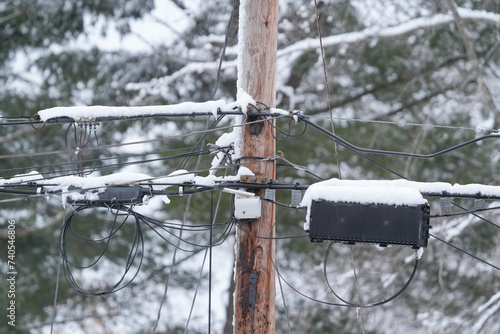 Utility pole and wires covered with snow in blizzard © nd700