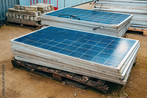 Old obsolete solar panels in factory yard