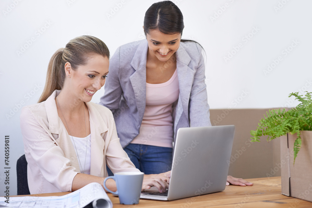 Business women, interior design and laptop with blueprint, reading and typing for new beginning in modern office. People, partnership and entrepreneurship with architecture, creative and boxes at job Business women, interior design and laptop with blueprint, reading and typing for new beginning in modern office. People, partnership and entrepreneurship with architecture, creative and boxes at job