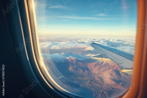 A stunning view of mountains from an airplane window. Perfect for travel blogs and magazines