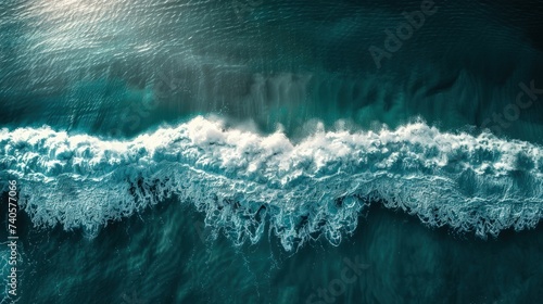 Sea wave with foam. Ocean background with sand and beach. Summer postcard for travel and holiday advertising.