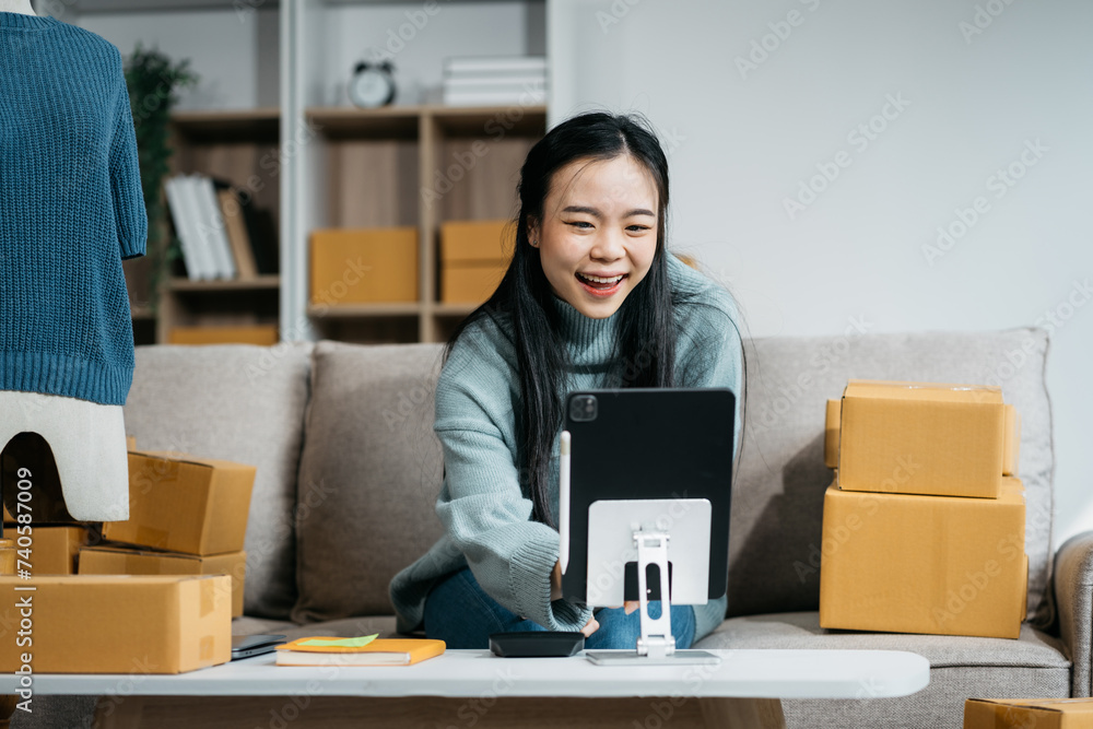 Woman start up small business owner at workplace. small business entrepreneur SME or freelance asian woman working with box at home... Woman start up small business owner at workplace. small business entrepreneur SME or freelance asian woman working with box at home...