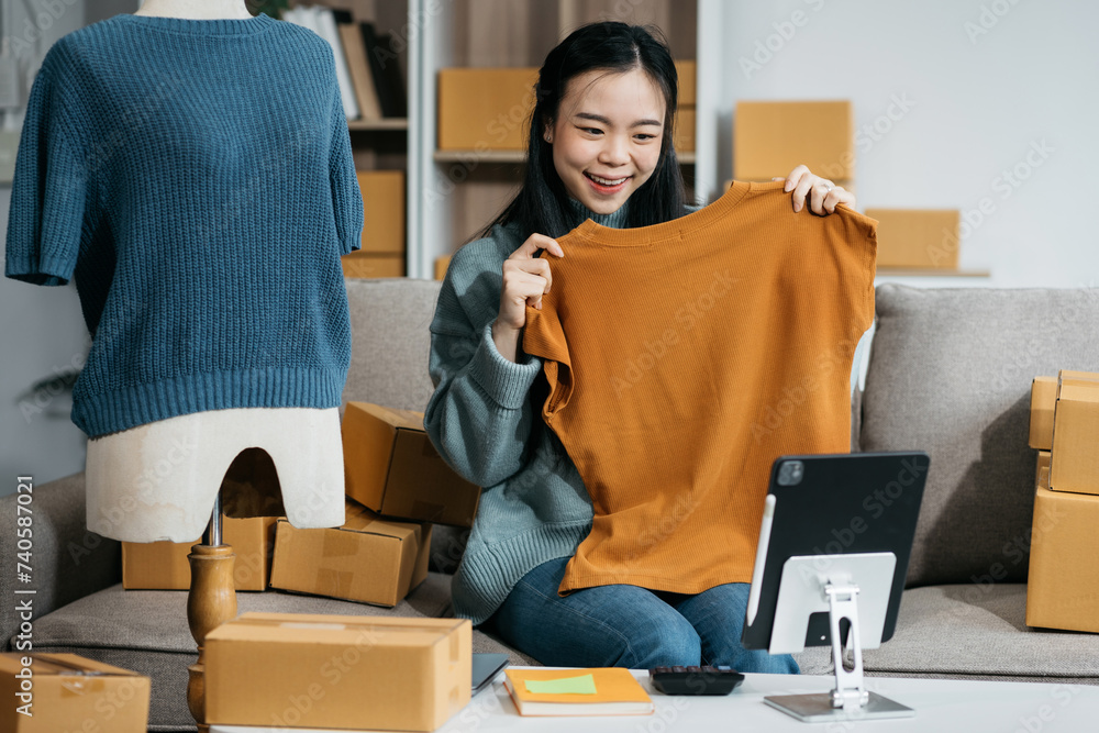 Asia vlogger woman influencer, SME retail store owner smile enjoy selling show live sale online screen smartphone and laptop work at home... Asia vlogger woman influencer, SME retail store owner smile enjoy selling show live sale online screen smartphone and laptop work at home...