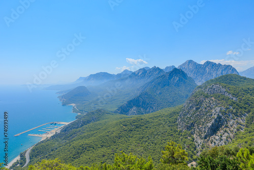 From the Tunektepe Cable Car, a panoramic view of Antalya coast in Turkey. The clear blue sky completes this breathtaking vista, showcasing the natural and urban beauty of Antalya city.