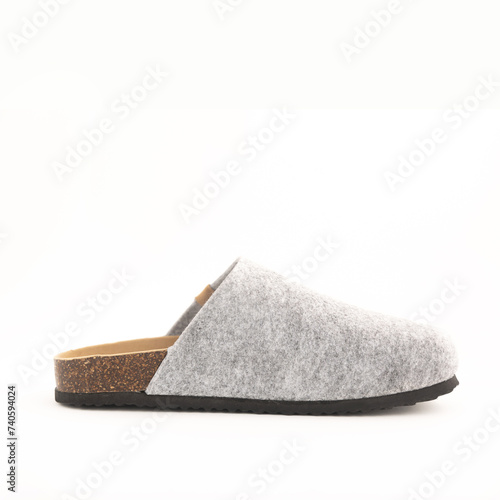 Side view Cozy gray slipper on white floor