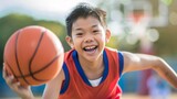 Young boy with basketball smiling, youth sports and active lifestyle concept.