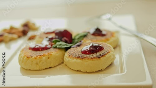 Wallpaper Mural For breakfast, homemade fried syrniki on table, topped with jam. Dessert option features syrniki with sweet jam. Enjoy this delightful dessert with jam for a satisfying start to your day. Torontodigital.ca