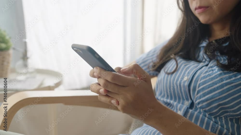 Hand. Asian woman using texting mobile phone or chat.Close-up business hand Hand. Asian woman using texting mobile phone or chat.Close-up business hand