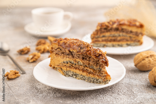 Walnut and hazelnut cake with caramel on brown concrete. side view, selective focus